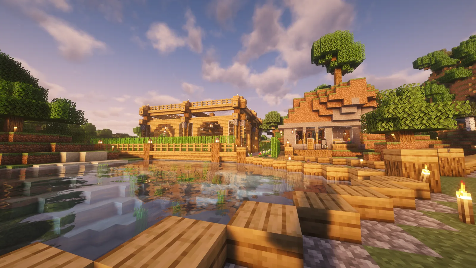 Waterfront builds and docks beside a reflective lake on Manja SMP